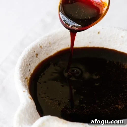 Sweet Soy Sauce Substitute: How to Replace Kecap Manis in Recipes 7 Homemade sweet soy sauce substitute (Indonesian kecap manis) drizzling from a teaspoon into a soy sauce pourer.