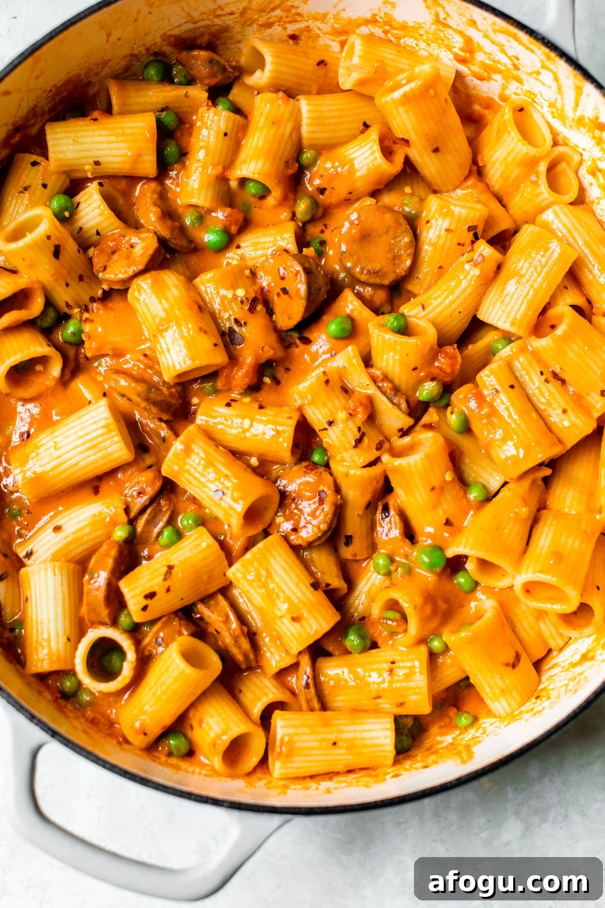 Creamy Italian Chicken Sausage Pasta with Sun-Dried Tomatoes 2 pasta and sausage in a skillet