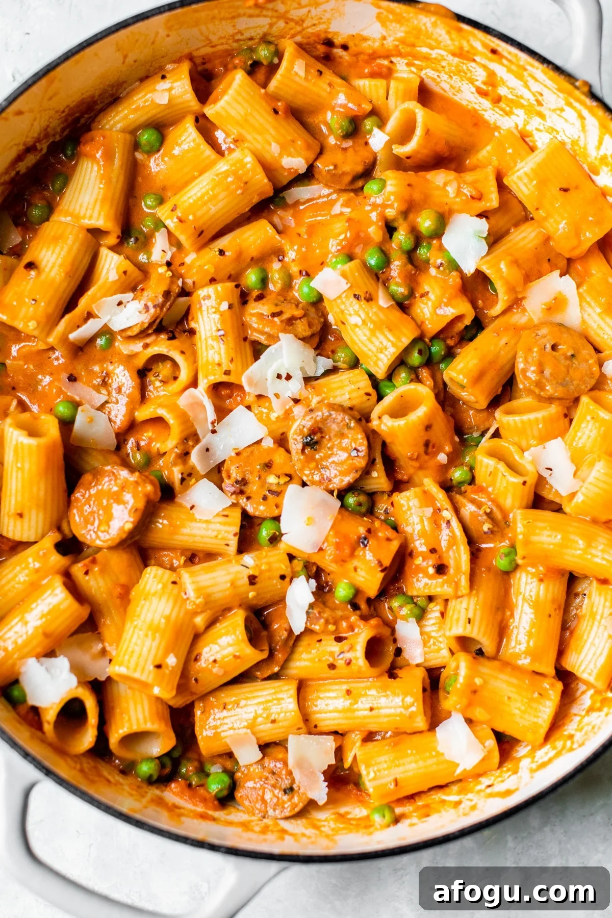 Creamy Italian Chicken Sausage Pasta with Sun-Dried Tomatoes 5 pasta, peas and sausage in a skillet