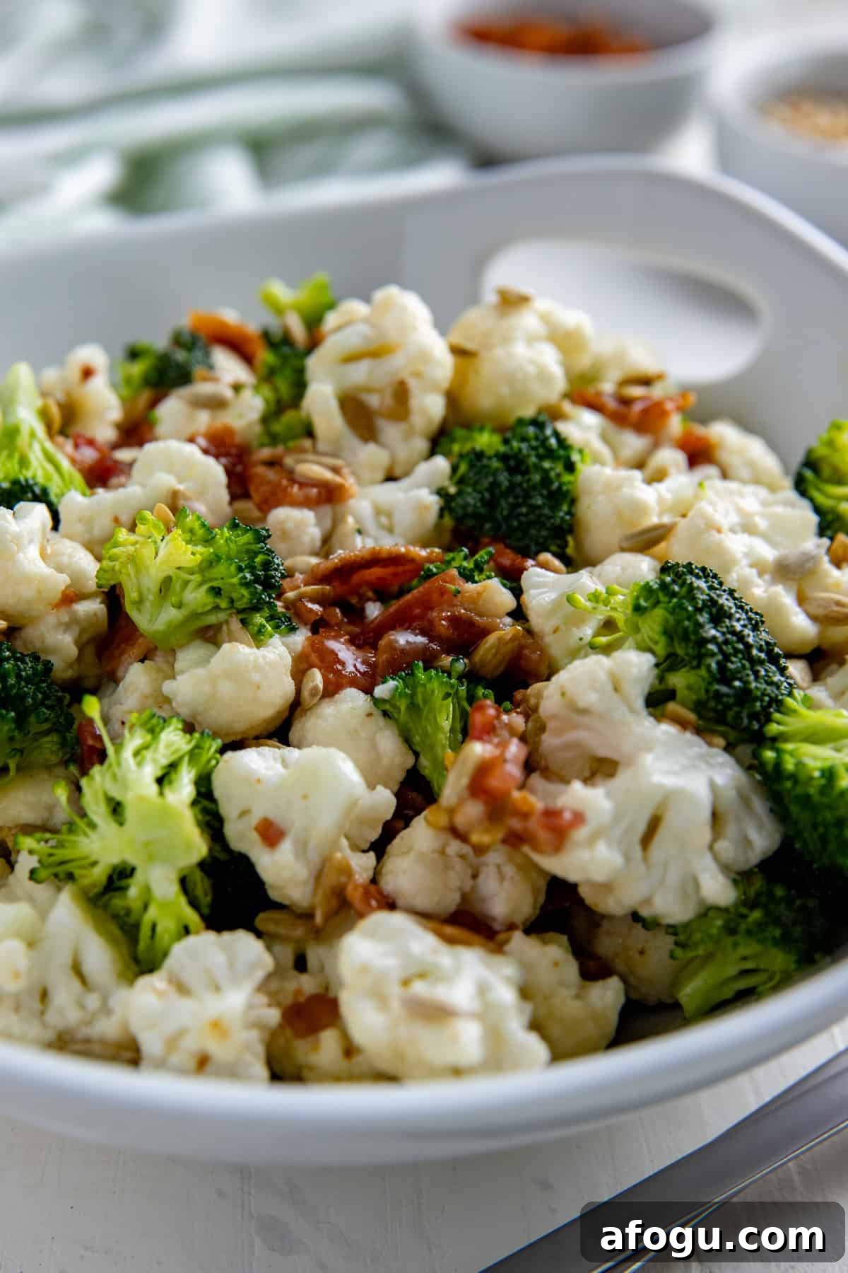 Broccoli and Cauliflower Salad in a white serving bowl.