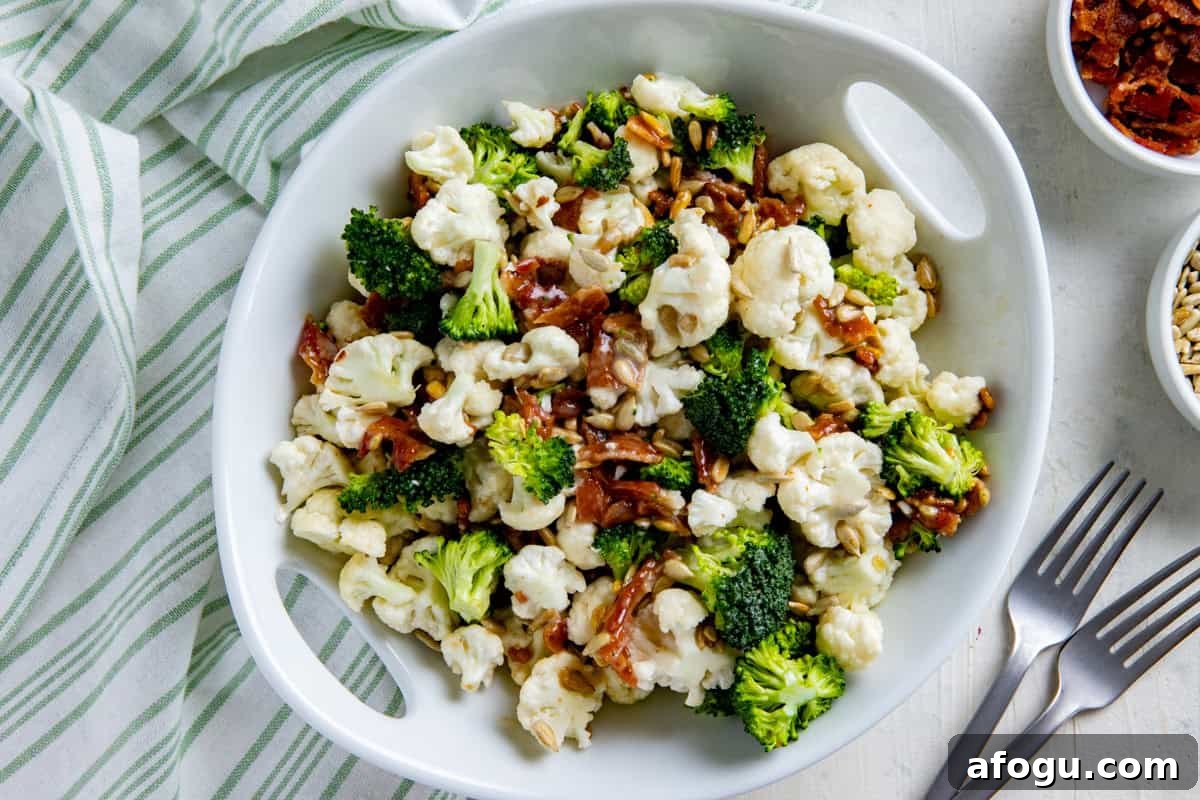 Broccoli and Cauliflower Salad in a white serving bowl.