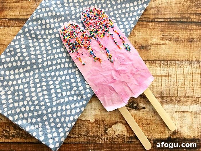 popsicle craft made with a paper plate