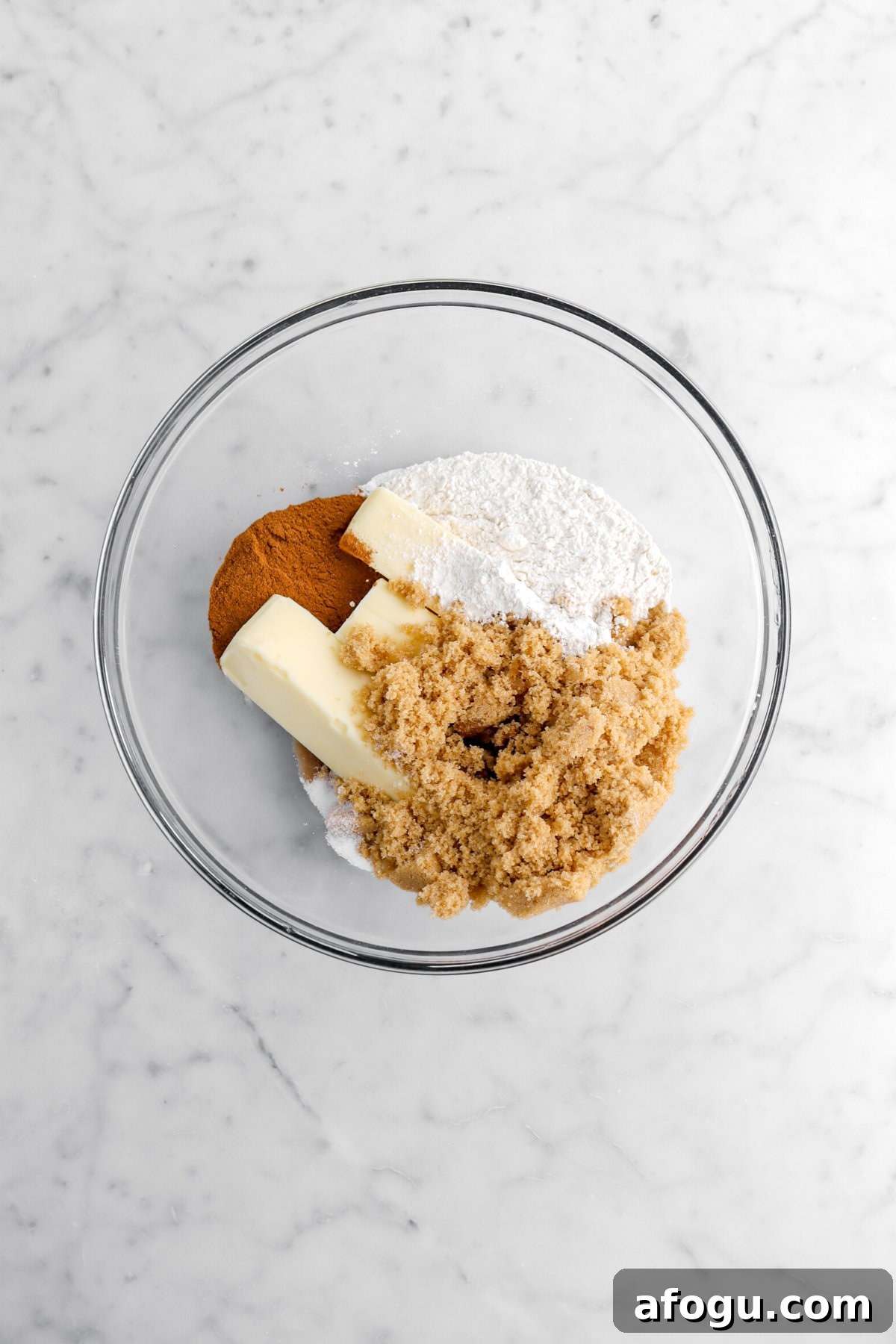butter, brown sugar, flour, cinnamon, salt, and vanilla in glass bowl.