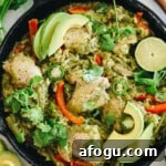 chicken thighs, cilantro, lime and rice in a cast iron.
