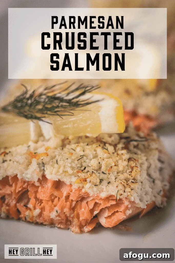 Parmesan crusted salmon garnished with lemon slices and dill with text overlay - Parmesan Crusted Salmon.