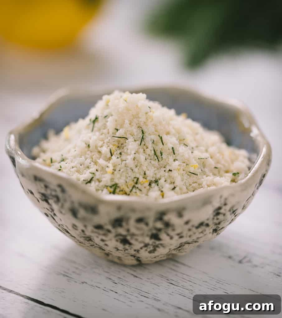 Shredded parmesan and seasonings in a small bowl.