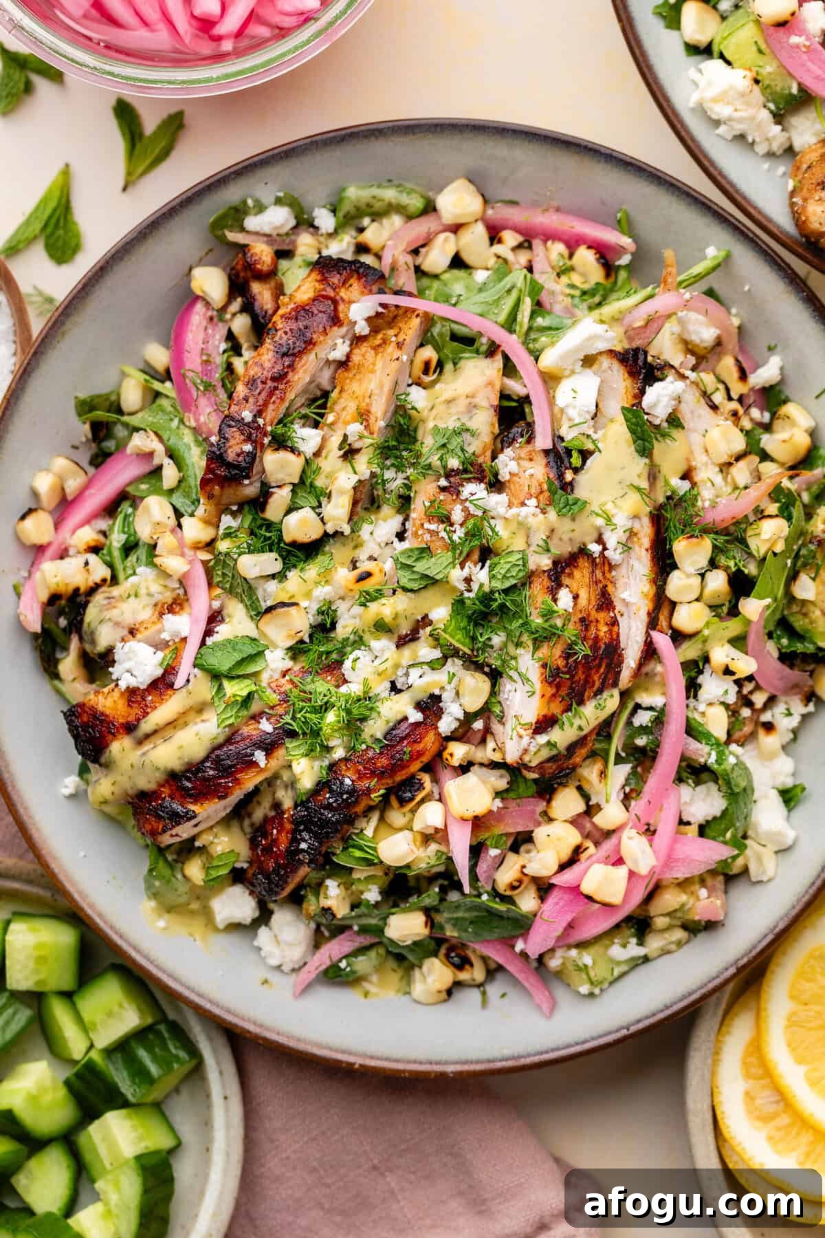 avocado-dill-feta-salad-9 Grilled chicken salad with charred corn, pickled red onions, fresh greens, herbs, and crumbled cheese drizzled with a yellow dressing