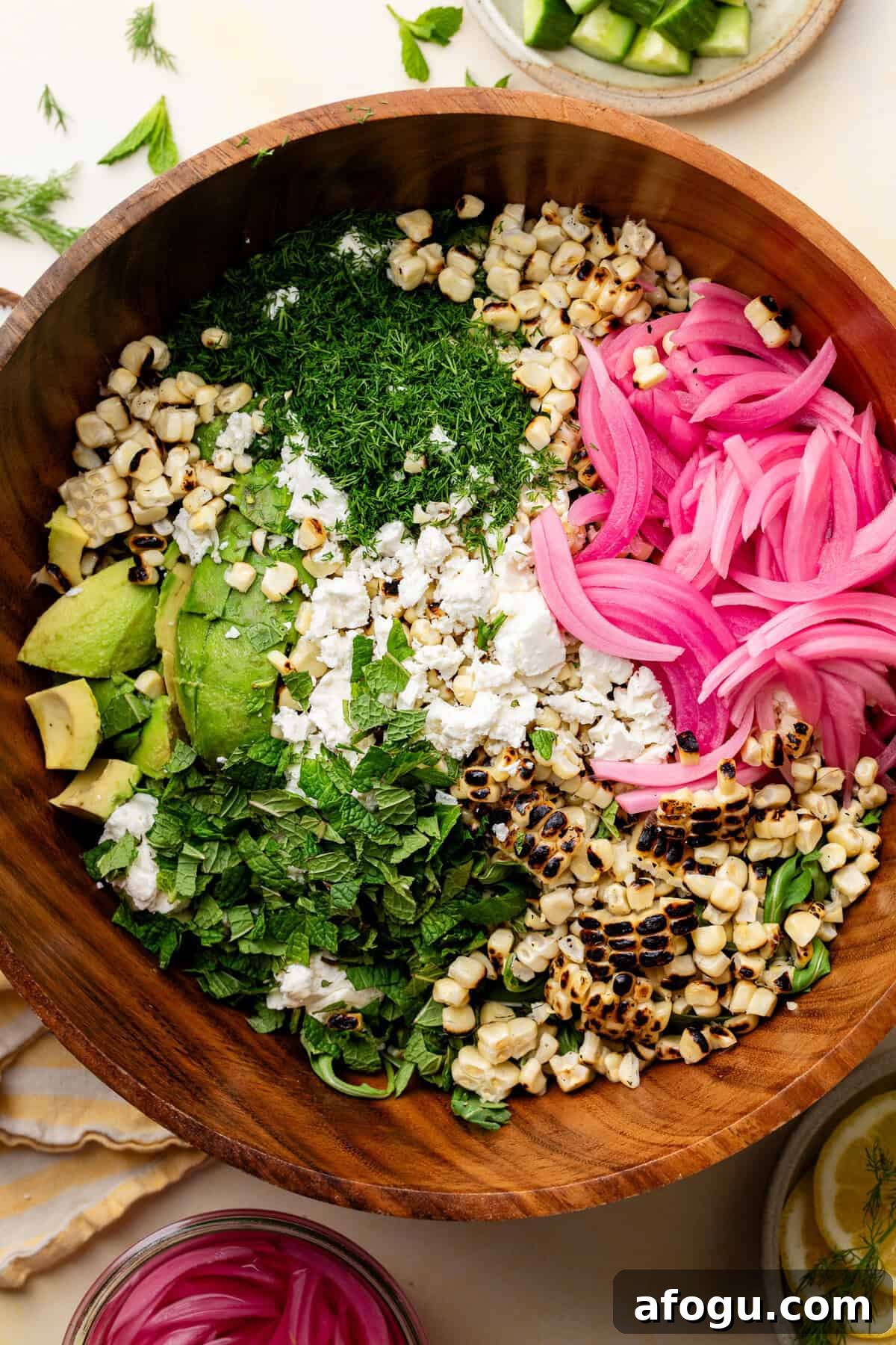 Summer Corn, Avocado & Feta Salad with Fresh Dill 3 Corn Avocado Feta Dill Salad ingredients in wooden bowl.