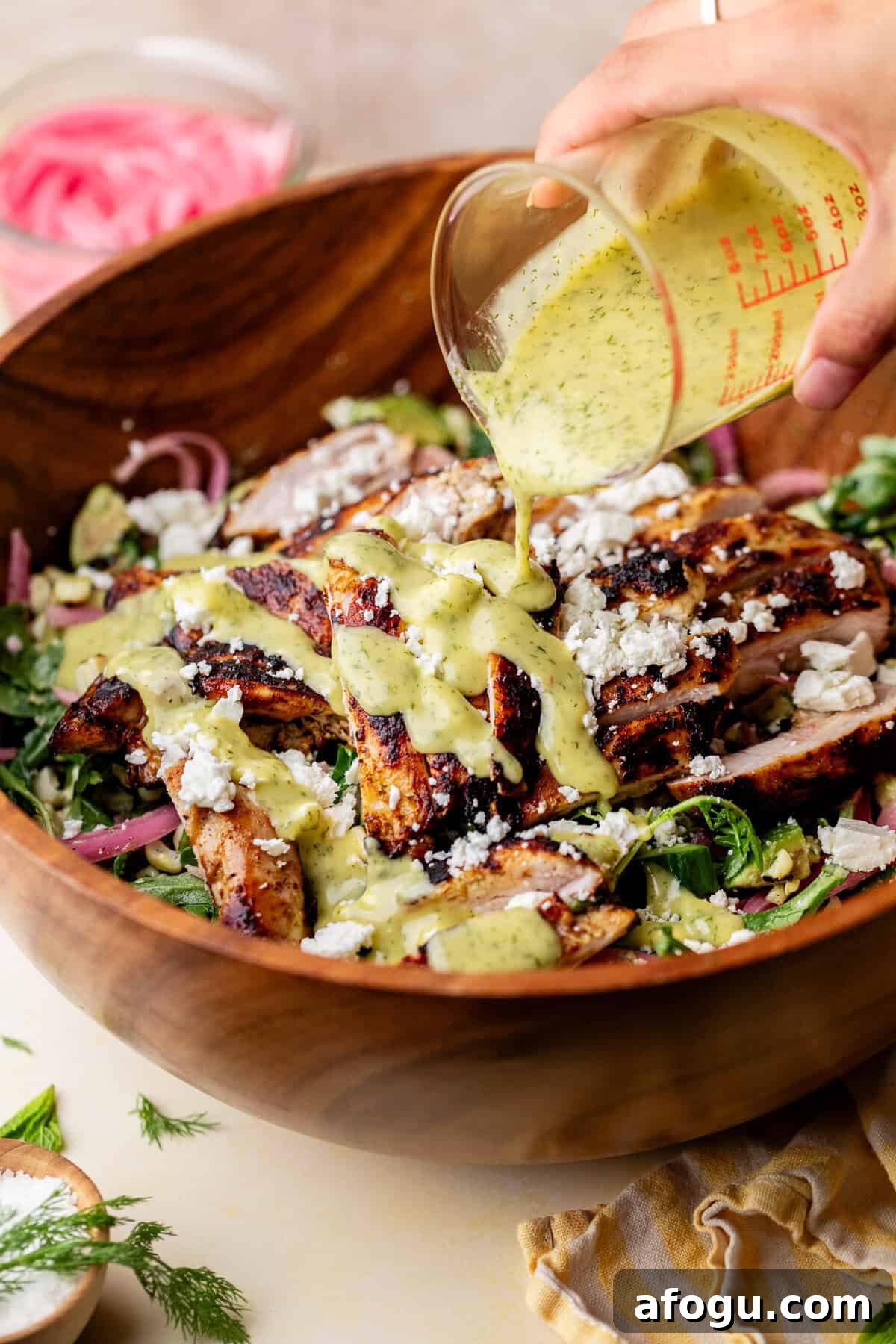 Summer Corn, Avocado & Feta Salad with Fresh Dill 5 pouring dressing on salad