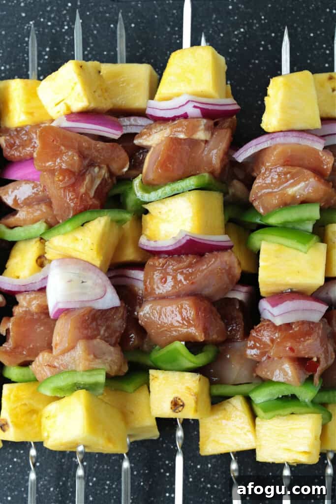 chicken, vegetables and pineapple on skewers
