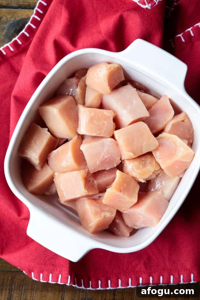 cubed chicken in dish for marinating
