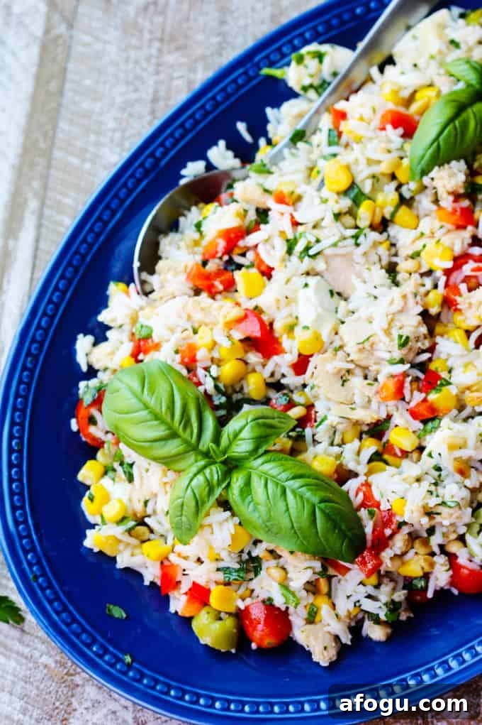 Italian Rice Salad with Tuna Italian rice tuna salad on a blue serving plate