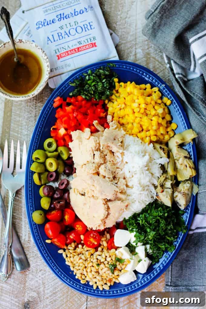Ingredients for Italian Rice Salad with Tuna Ingredients for Italian rice salad with tuna on blue plate