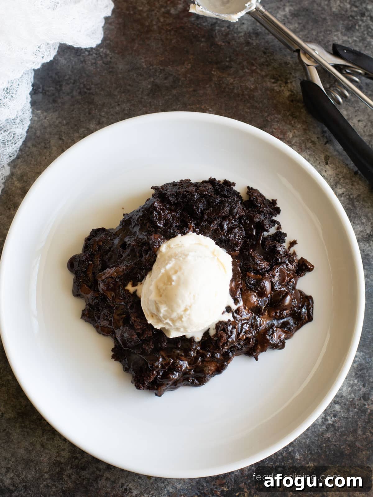 Gluten-Free Slow Cooker Chocolate Lava Cake Recipe 8 The top view of a serving of lava cake with vanilla ice cream.