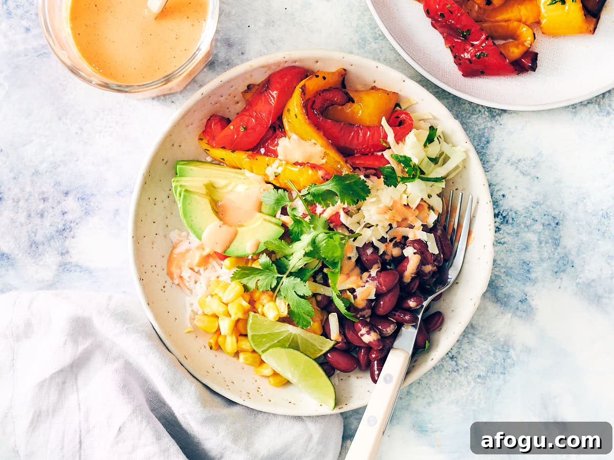 Burrito Bowl with Air Fryer Bell Peppers drizzled with Red Pepper Crema.