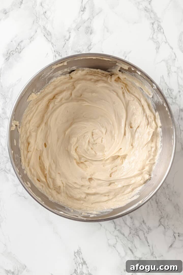 Beaten vegan cream cheese and brown sugar in bowl.