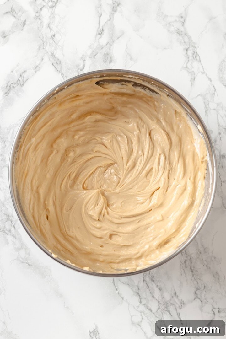 Biscoff cheesecake mixture in bowl.