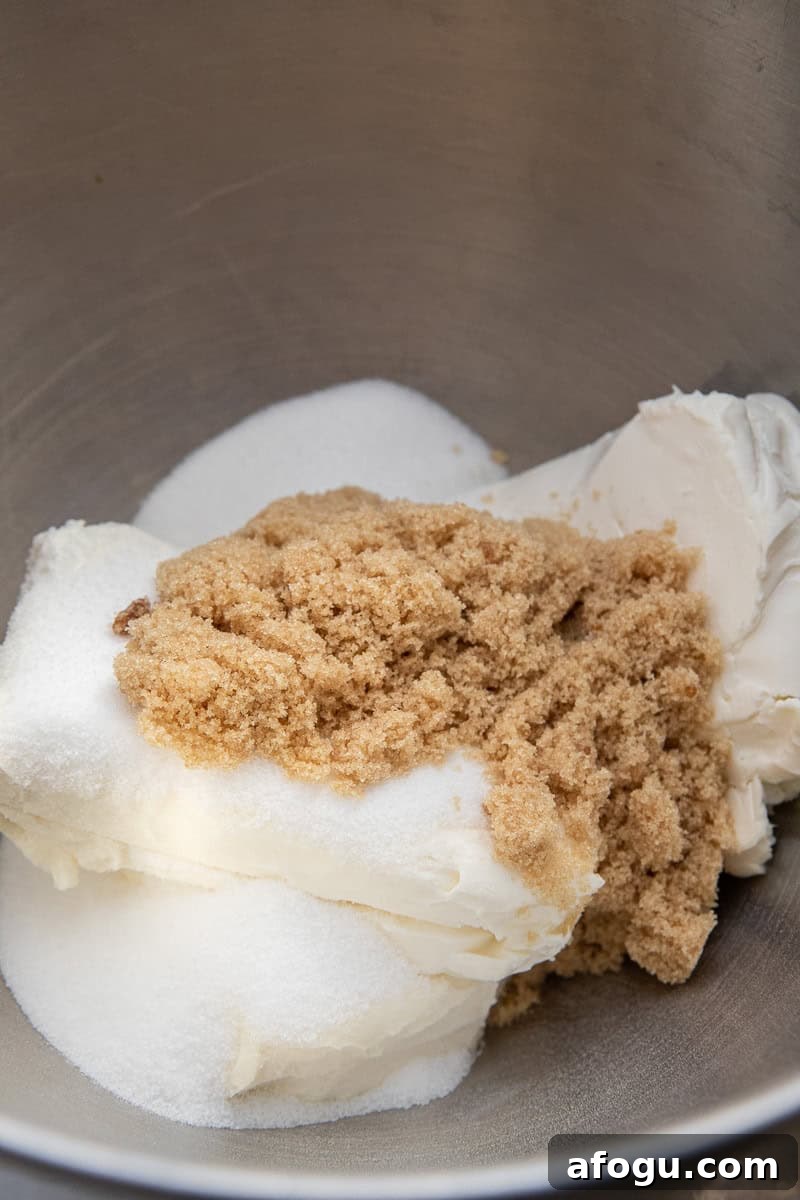Cream cheese and sugar in a bowl