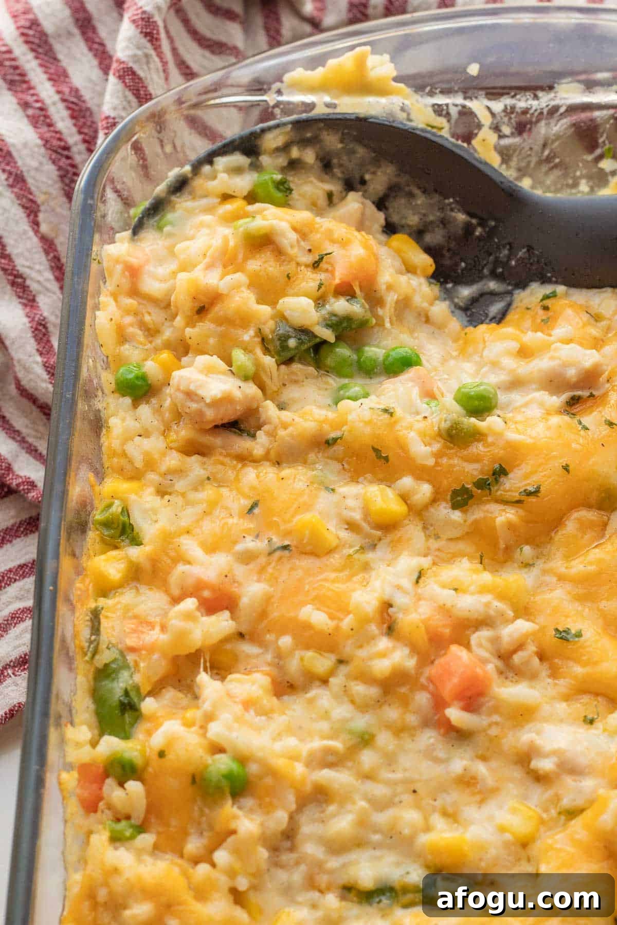 Baked Chicken and rice casserole in glass baking dish.