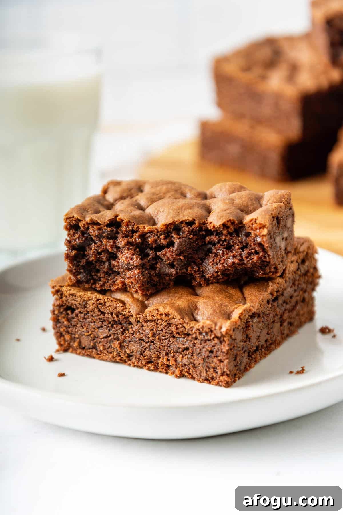 Two serving cake mix brownies sitting on a white round plate.