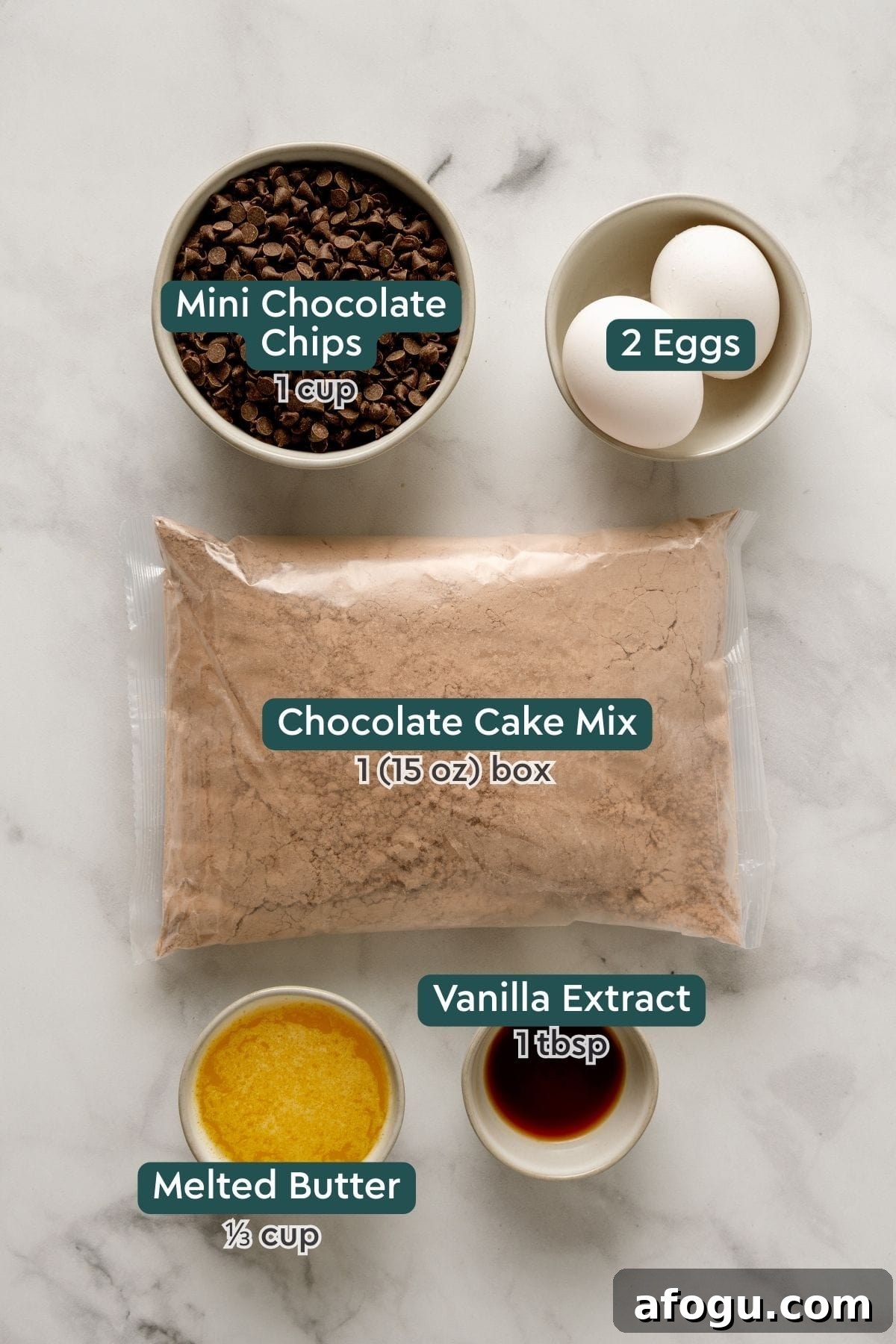 All of the ingredients for boxed cake mix brownies on a white countertop.