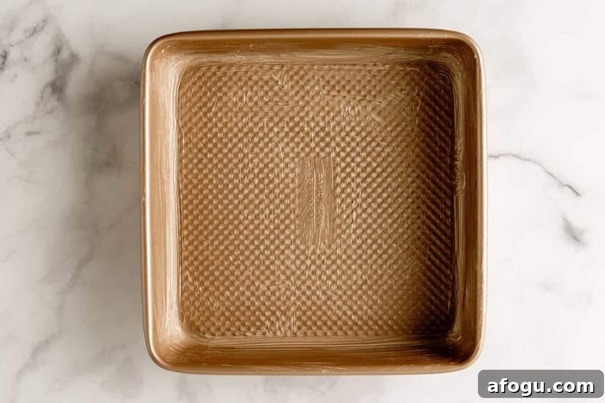Greased square baking dish.