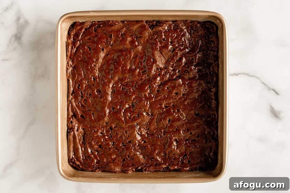 Batter in pan for cakebox brownies.
