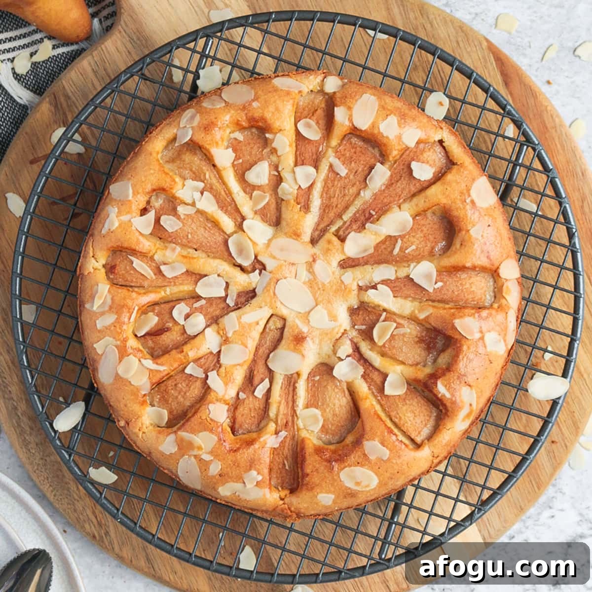 Pear Almond Cake from above on a cooling rack.