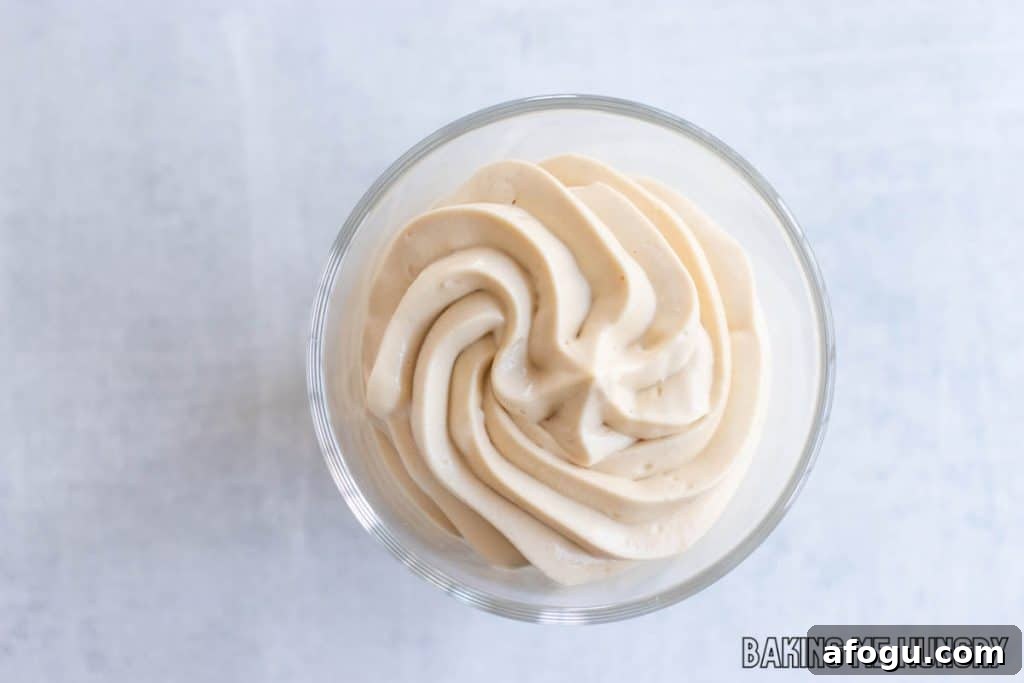 caramel mousse piped into glass from overhead