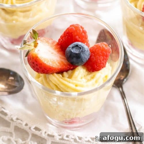 vanilla bean custard in jar with berries
