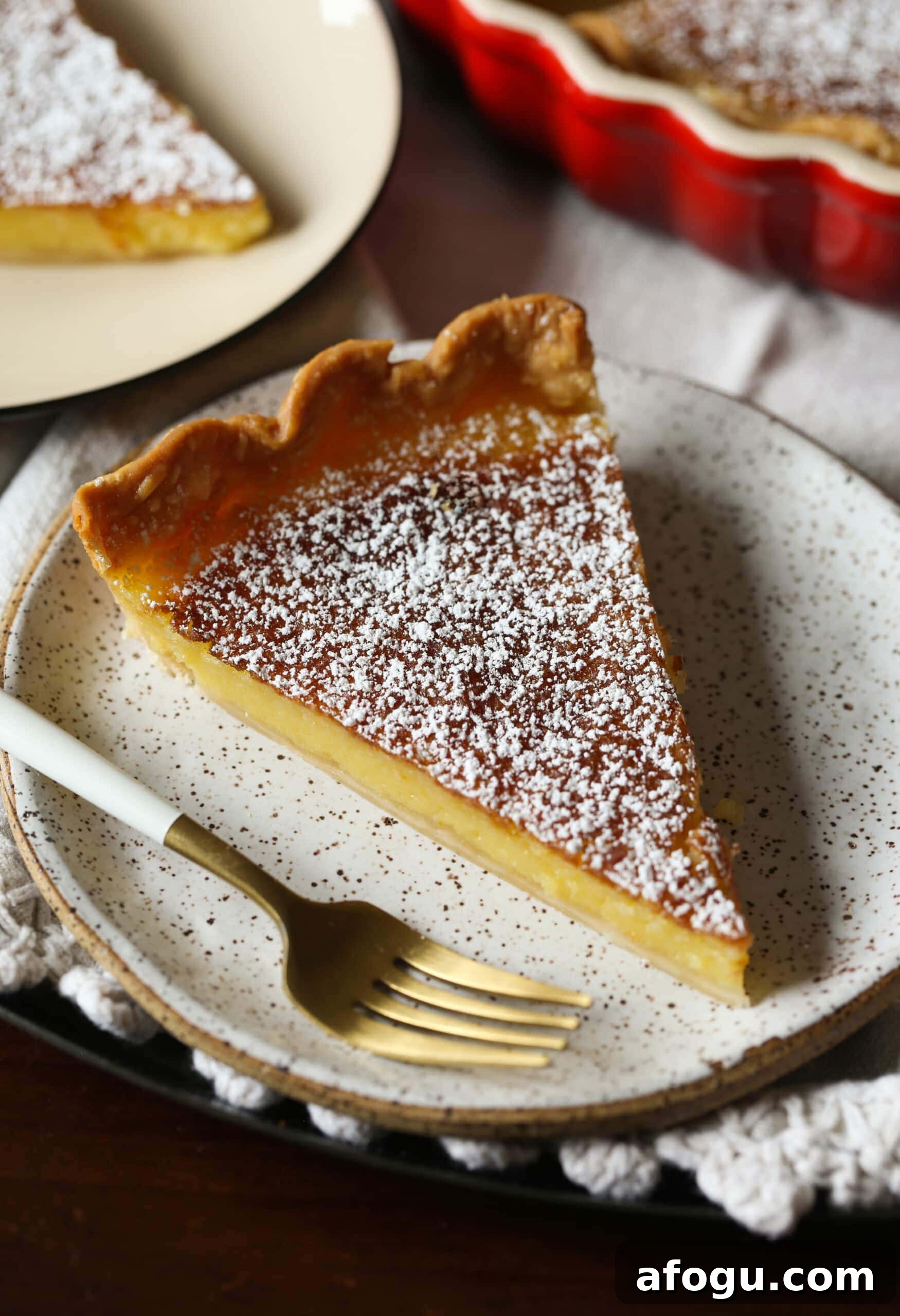 Classic Lemon Chess Pie Recipe — Tangy Southern Dessert 2 A slice of Lemon Chess Pie on a plate