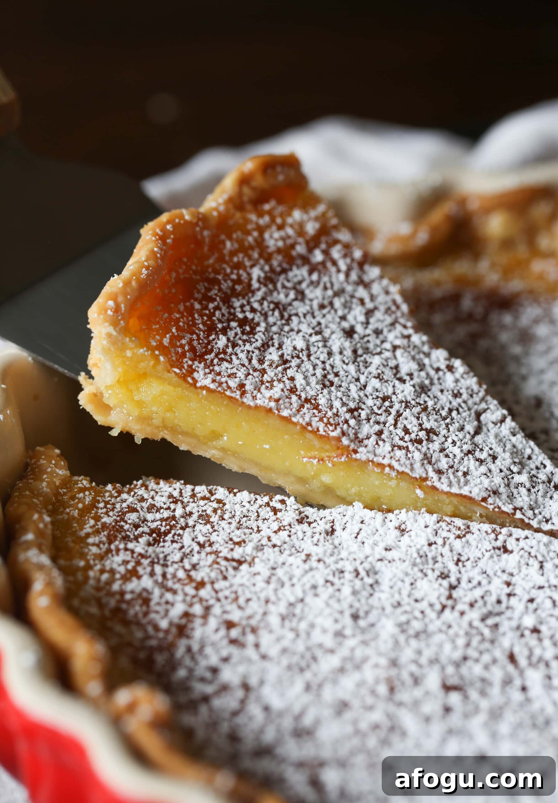Classic Lemon Chess Pie Recipe — Tangy Southern Dessert 7 serving a slice of chess pie