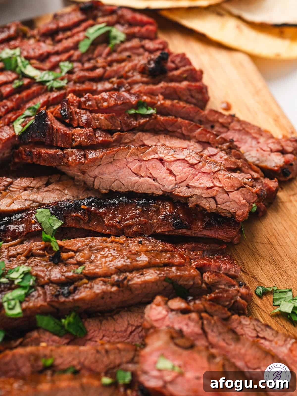 These vibrant Baja Steak Tacos are loaded with zippy marinaded grilled skirt steak and topped with cotija cheese, radishes, and cilantro. Skirt steak sliced against the grain.