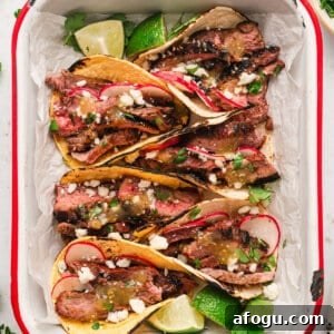 Baja-Style Steak Tacos with Tangy Slaw and Lime Crema 2 Overhead image of Baja street tacos.
