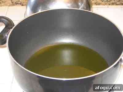 Heat oil in a pot.