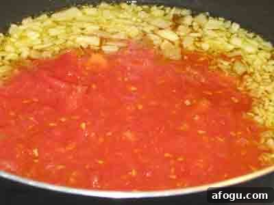 Add tomatoes and simmer.