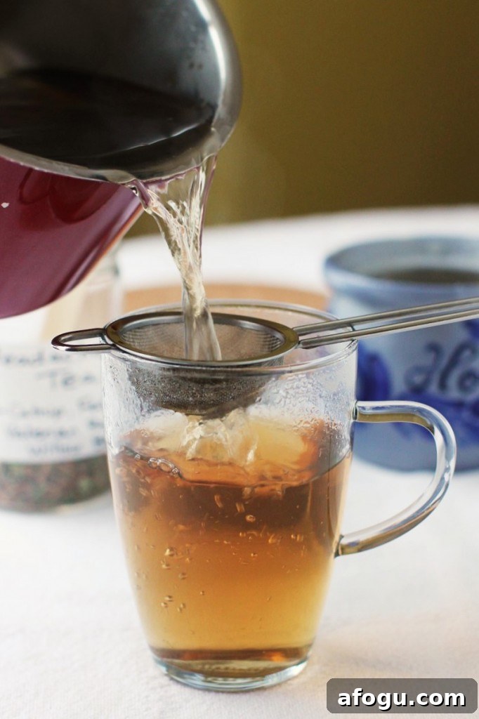 pouring a cup of headache tea
