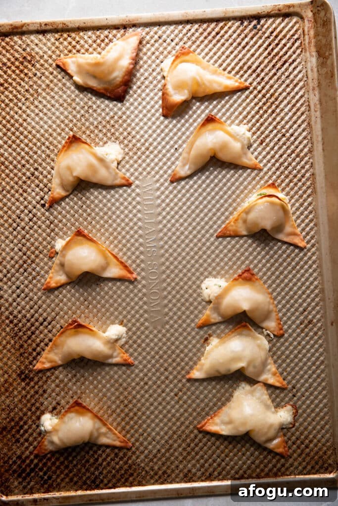 Crispy Baked Cream Cheese Wontons Recipe 5 cream cheese wontons after baking on a baking sheet