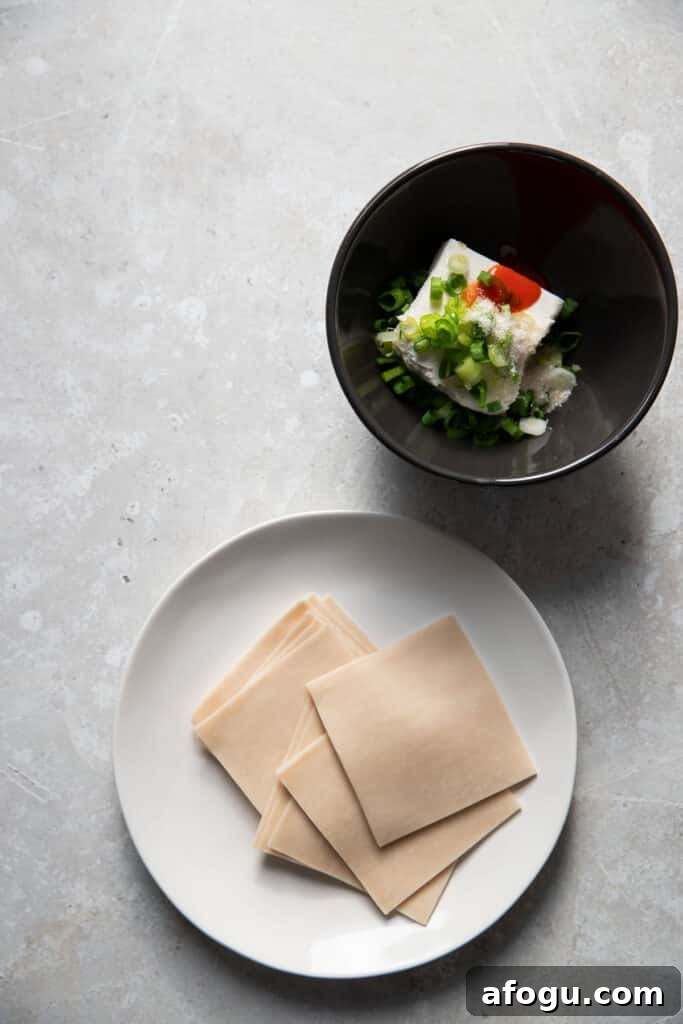 Crispy Baked Cream Cheese Wontons Recipe 6 wonton wrappers and cream cheese filling in a bowl