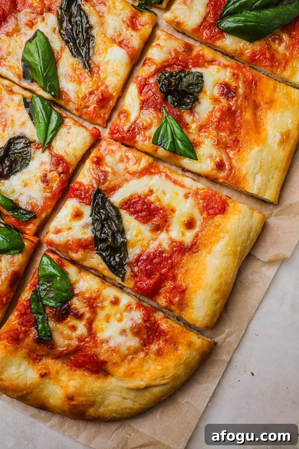 Homemade Margherita Pizza Recipe: Classic Neapolitan Flavor at Home 2 Homemade margherita pizza topped with authentic pizza sauce, mozzarella, and basil.