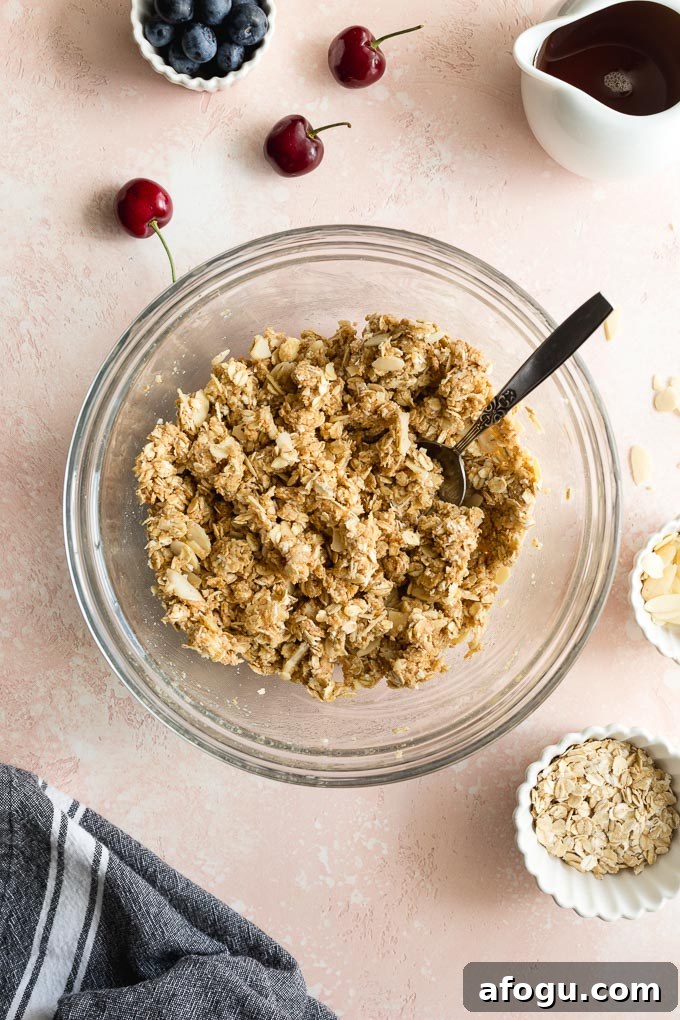 Crisp topping mixed together in a glass bowl.