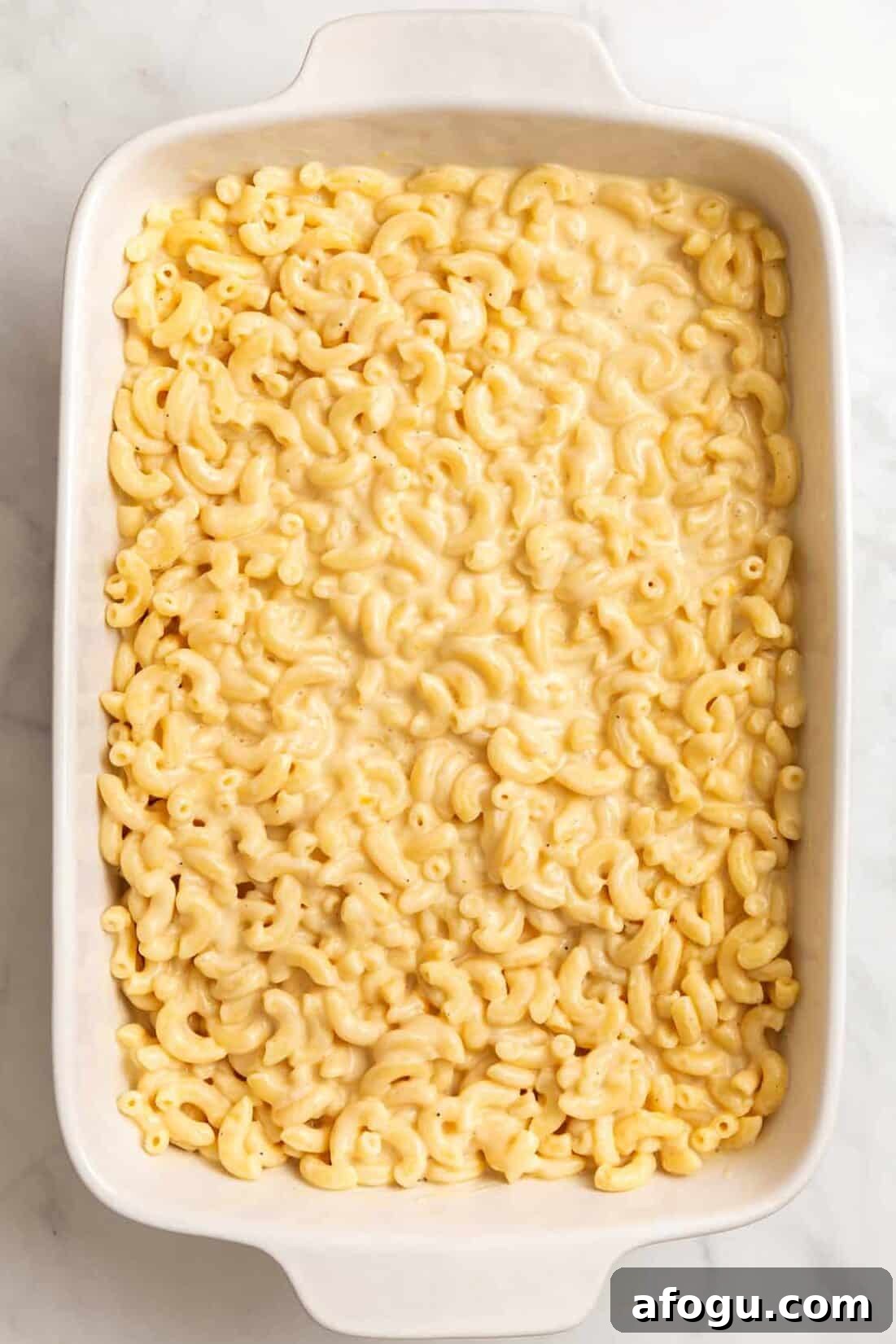 Copycat Cracker Barrel Mac and Cheese Recipe — Creamy Southern Style 6 top down image of a large 9x13 inch casserole of cracker barrel mac and cheese.