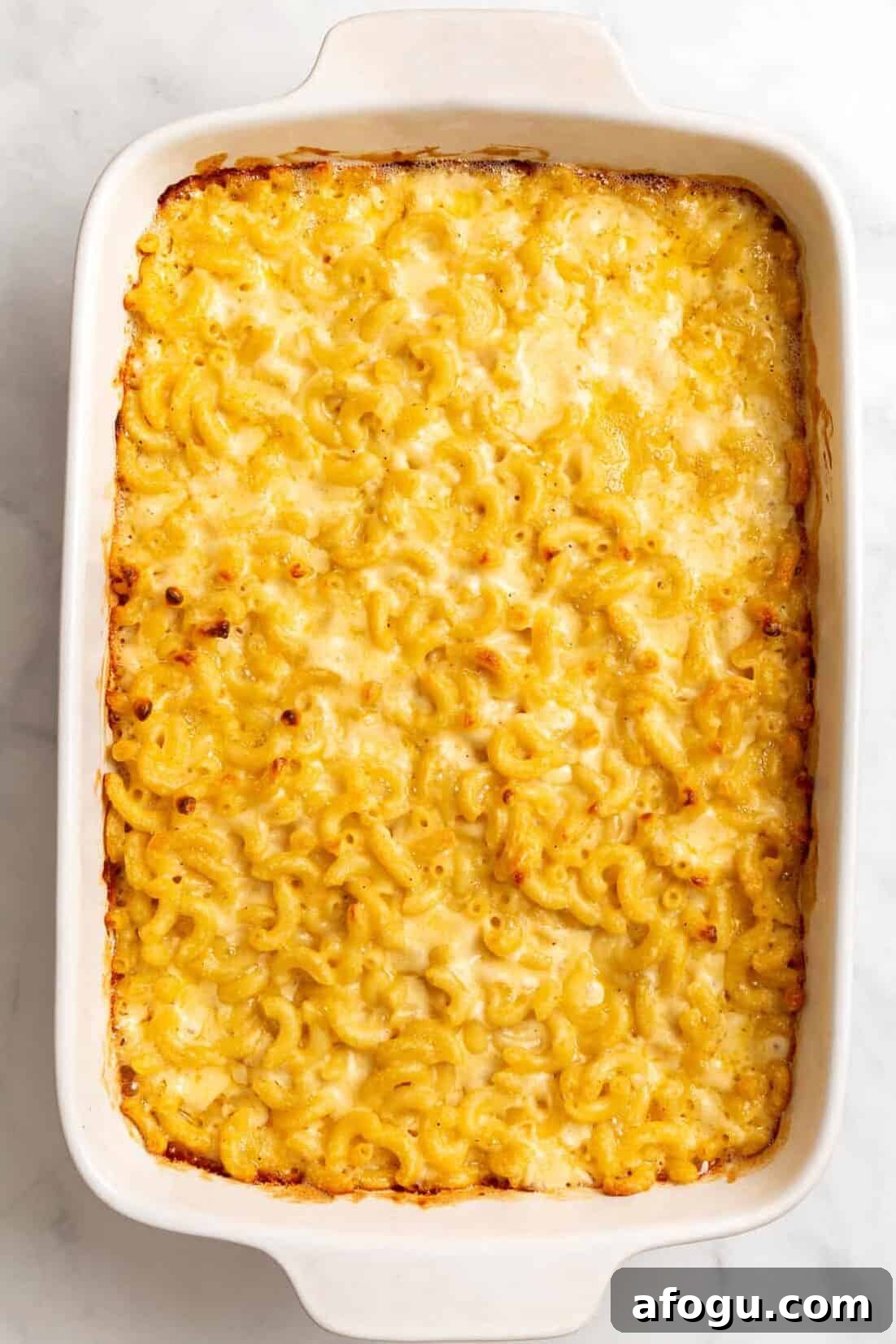 Copycat Cracker Barrel Mac and Cheese Recipe — Creamy Southern Style 7 top down image of a large 9x13 inch casserole of cracker barrel mac and cheese.