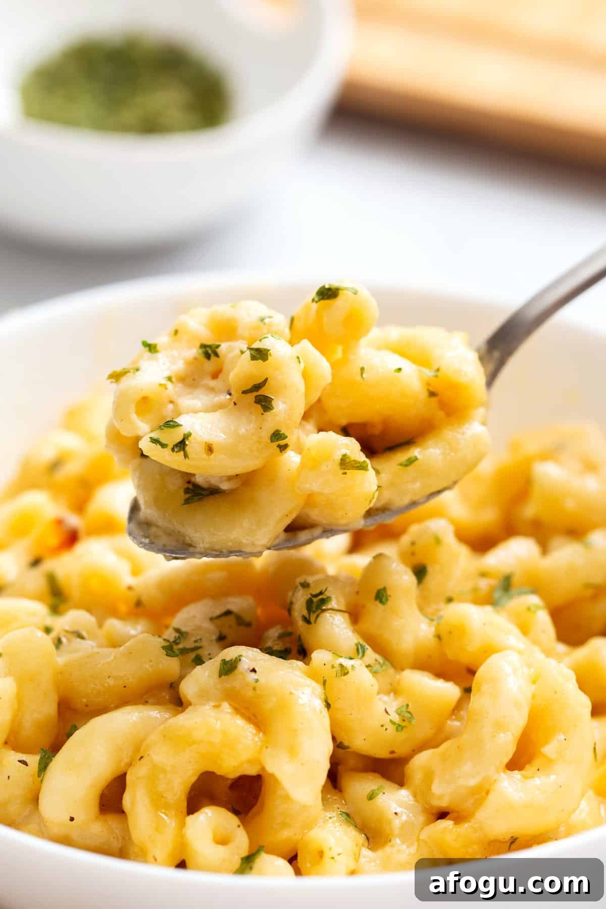 Copycat Cracker Barrel Mac and Cheese Recipe — Creamy Southern Style 8 close up image of a spoonful of cracker barrel mac and cheese.