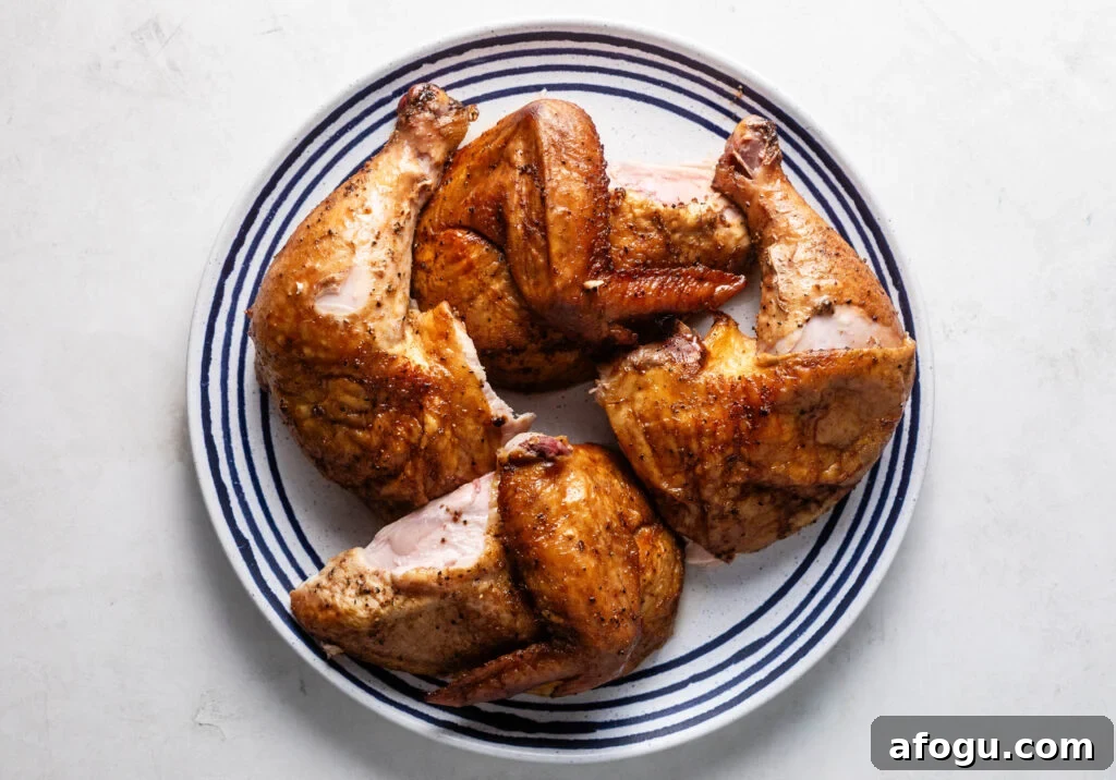 best smoked beer can chicken cut into pieces on plate