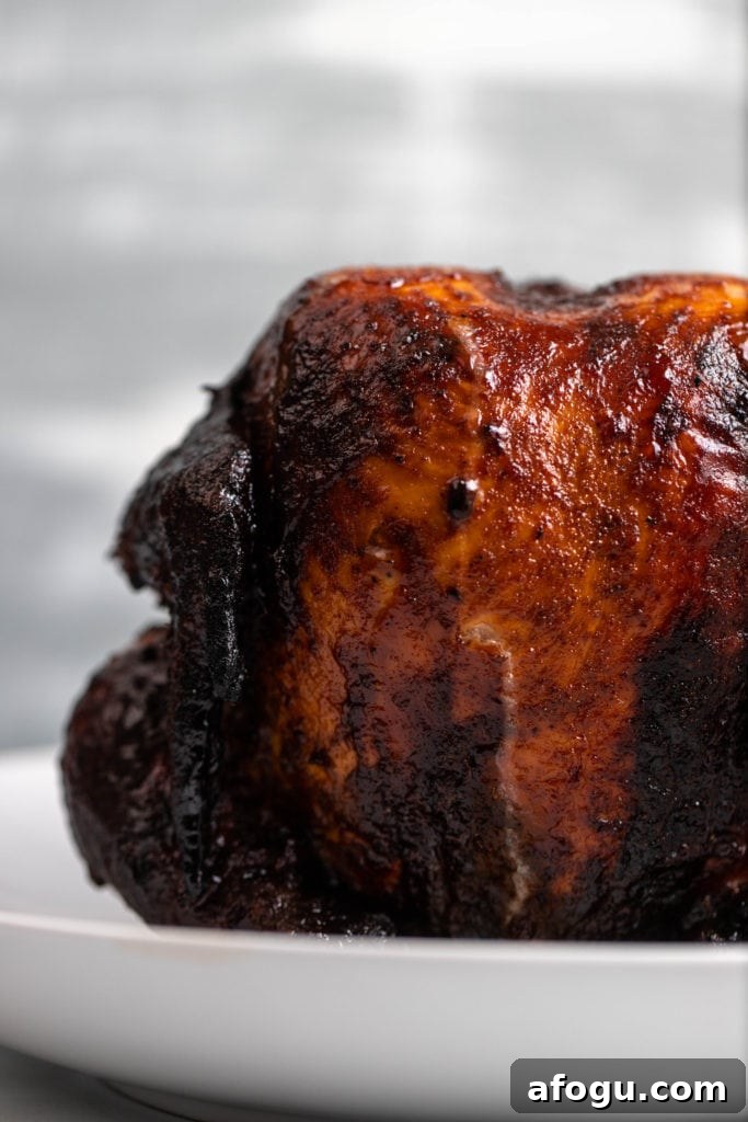 best smoked beer can chicken sitting in serving dish