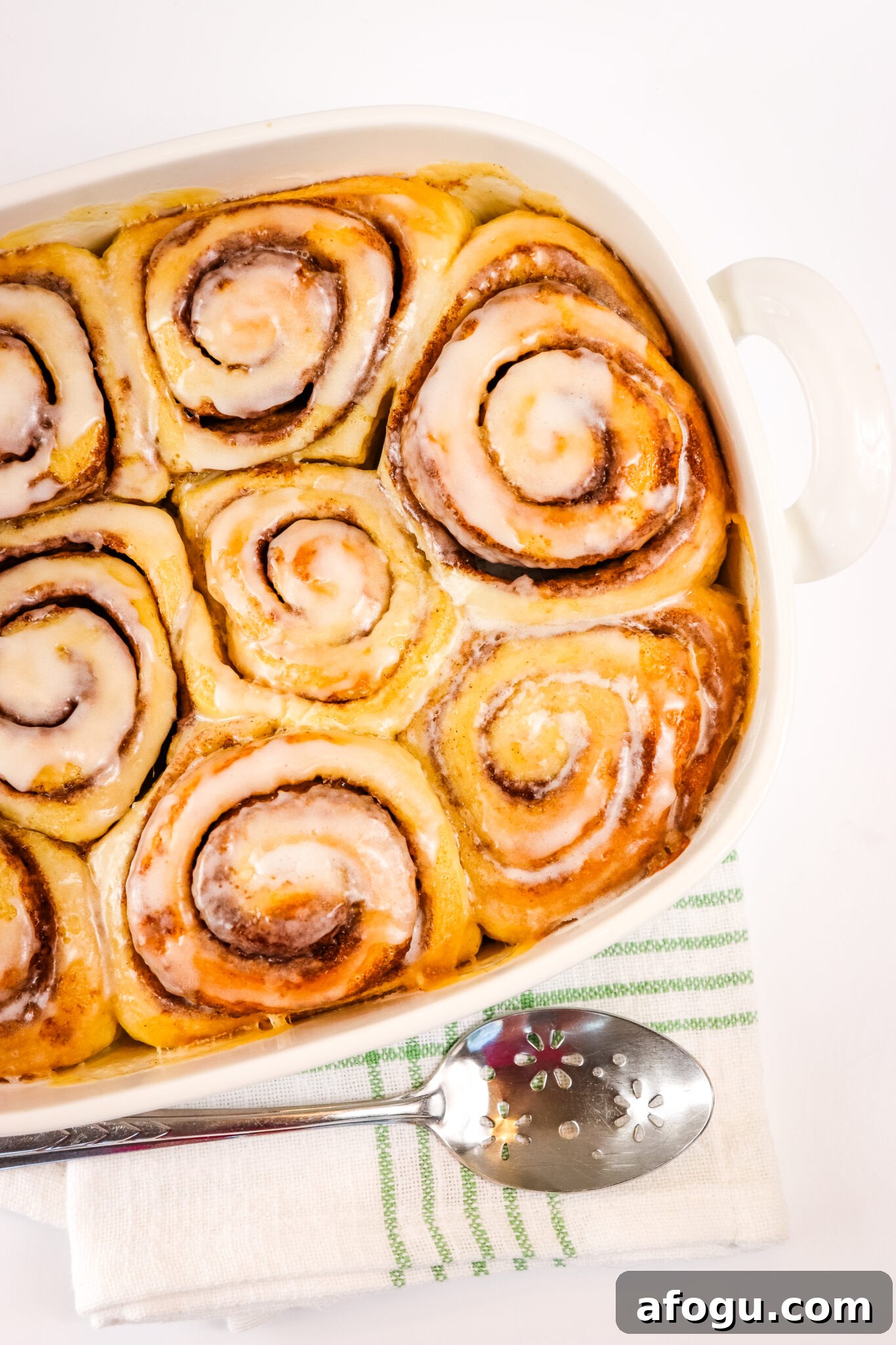 viral tiktok cinnamon rolls in large white serving dish
