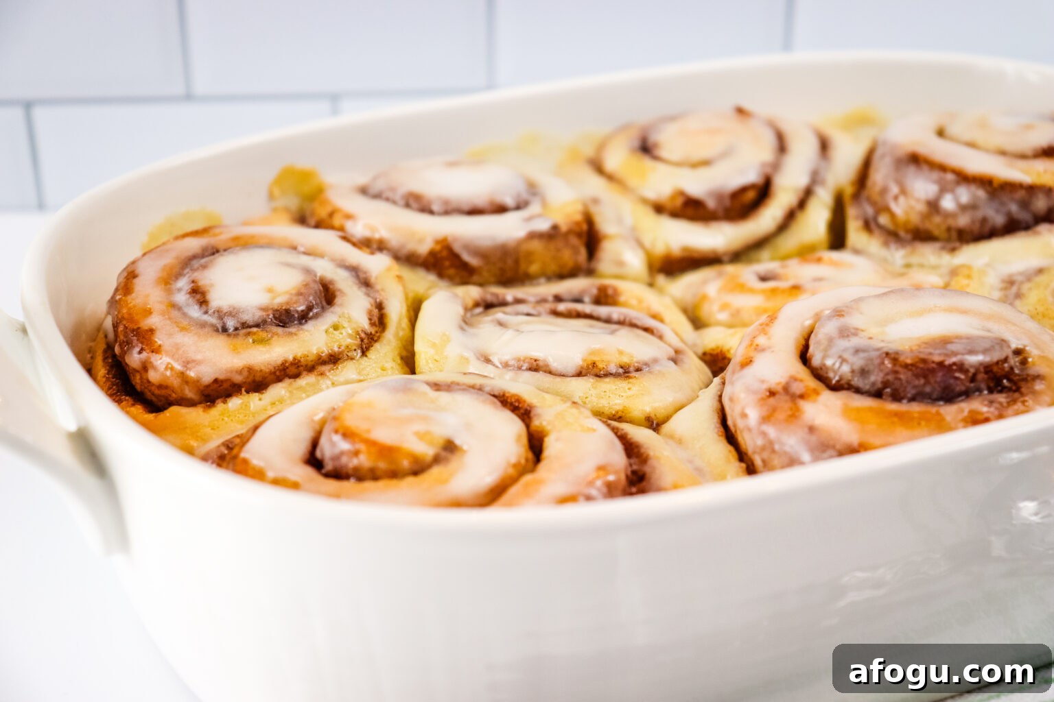viral tiktok cinnamon rolls in white baking dish