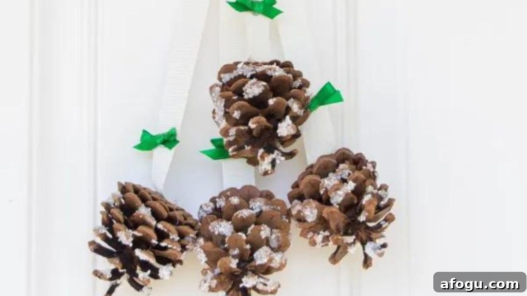 15 Pine Cone Crafts for Rustic Home Decor and Seasonal DIY 2 Snowy Pinecone Door Hanger