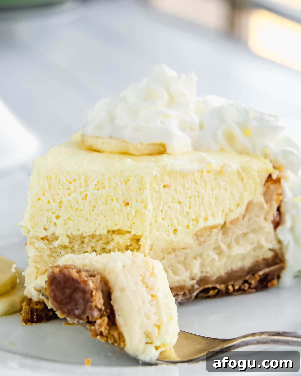 Banana cream cheesecake with whipped cream.